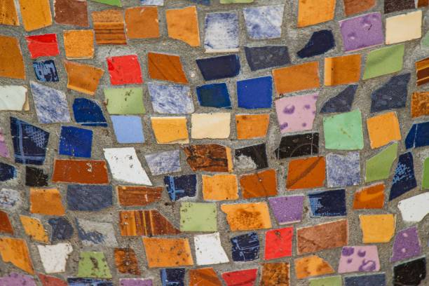istock Different colors of broken tiles on the wall 1444069794
