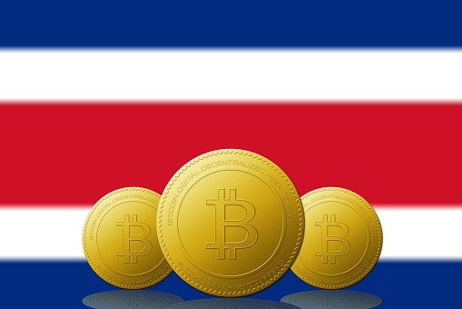 Three Bitcoins cryptocurrency with Costa Rica flag on background 3D ILLUSTRATION.