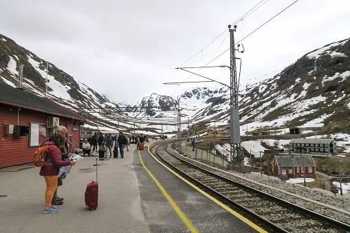 Myrdal, Norway – June 03, 2022: The people waiting at a stopover at Myrdal Station during train journey from Oslo to Flam in Norway