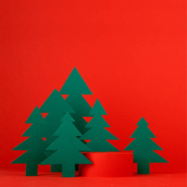 istock Christmas background with one cylinder podium and scene with 3d rendering for presentation gifts, cosmetics, goods in red color with green spruce forest, square. New year template for advertising. 1444071880