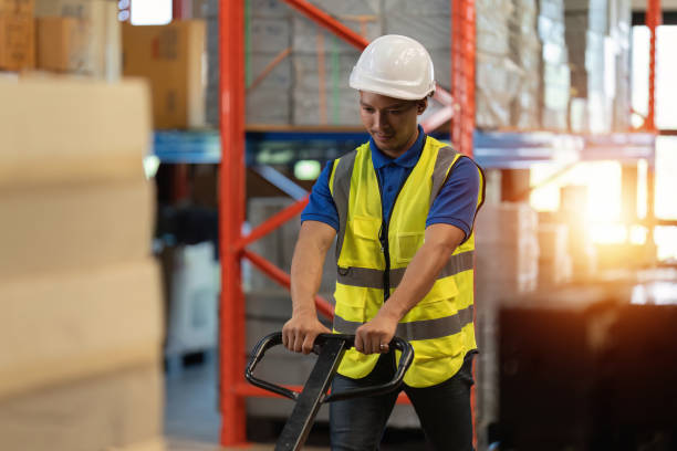 istock Working at warehouse. Male warehouse worker checking in storage department. Employee organizing goods distribution to the market. 1444072771