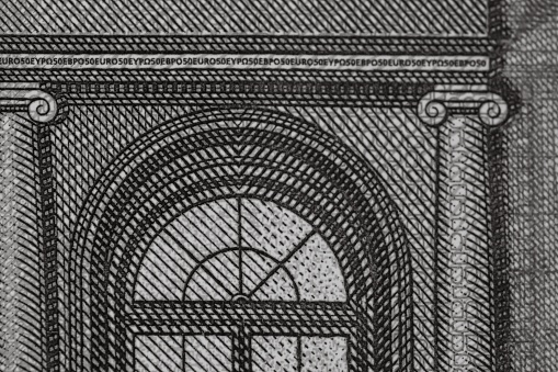 A greyscale closeup shot of a  detail on a 5 Euro banknote