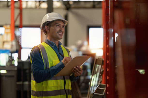 istock Working at warehouse. Male warehouse worker checking in storage department. Employee organizing goods distribution to the market. 1444073343