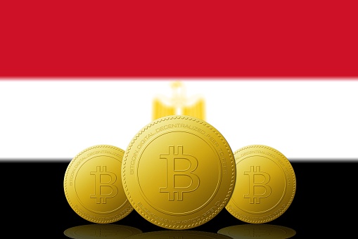 Three Bitcoins cryptocurrency with Egypt flag on background 3D ILLUSTRATION.