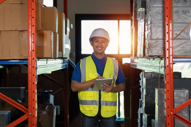 istock Working at warehouse. Male warehouse worker checking in storage department. Employee organizing goods distribution to the market. 1444076397