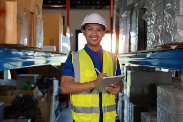 istock Working at warehouse. Male warehouse worker checking in storage department. Employee organizing goods distribution to the market. 1444076680