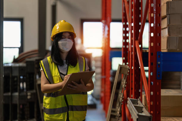 istock Working at warehouse. Male warehouse worker checking in storage department. Employee organizing goods distribution to the market. 1444076714