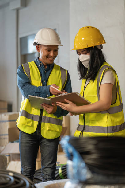 istock Working at warehouse. Male warehouse worker checking in storage department. Employee organizing goods distribution to the market. 1444077034