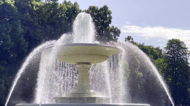 istock Beautiful fountain near the trees 1444077127