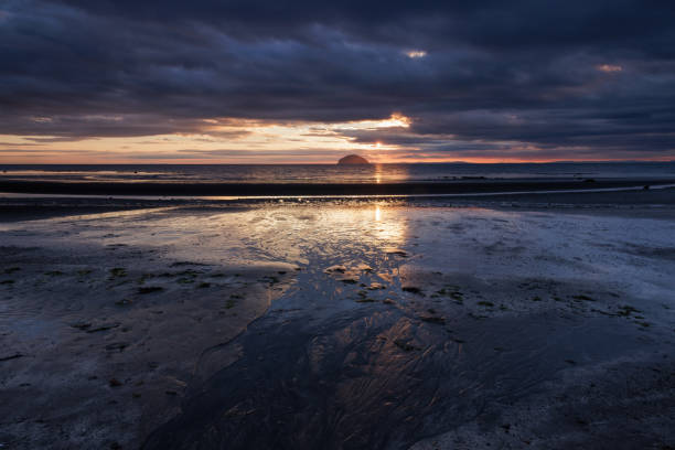 The view from Girvan to Ailsa Craig Ailsae Craig, is an island of 99 ha in the outer Firth of Clyde, high tide stock pictures, royalty-free photos & images