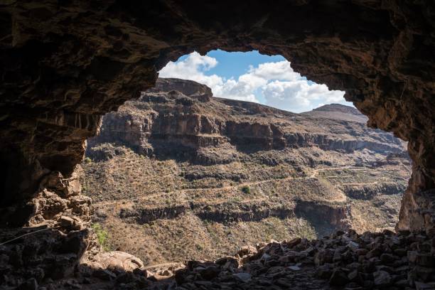 istock Rocky mountain landscape is seen from a cave 1444080284