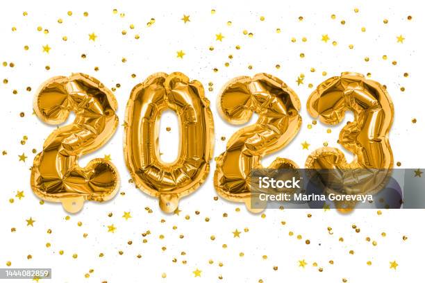Golden Foil Balloons Made Numbers 2023 On A White Background With Sequins New Years Card Happy New Year Celebration Party Greetings And Congratulation Concept Stock Photo - Download Image Now