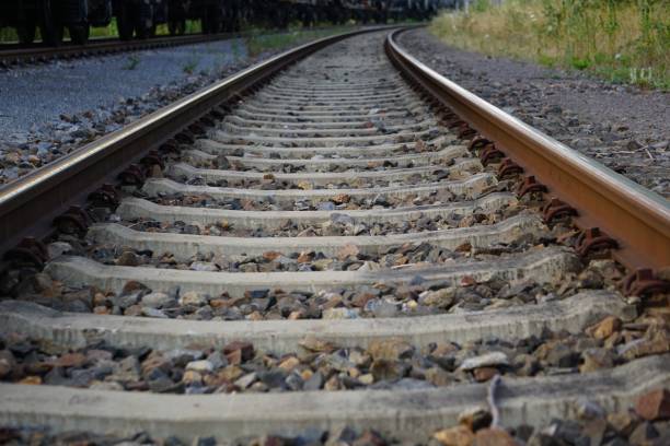 istock High-angle view of railways with stones on a sunny day 1444083540