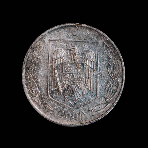 istock Romanian 500 Lei coin isolated on a black background 1444084340