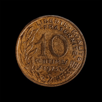 The tail face of 10 dinar coin, issued by Yugoslavia in 1974. Image isolated on black background