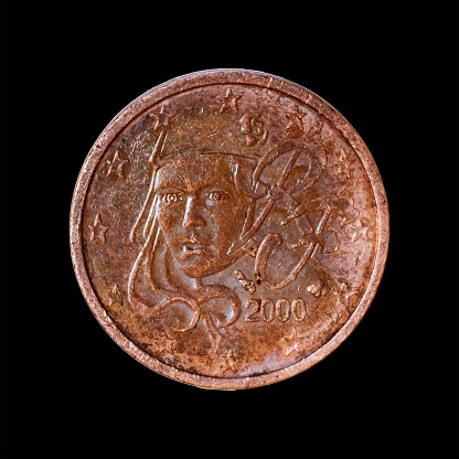 A closeup shot of the french 2 euro cent coin with the portrait of Marianne against a black background