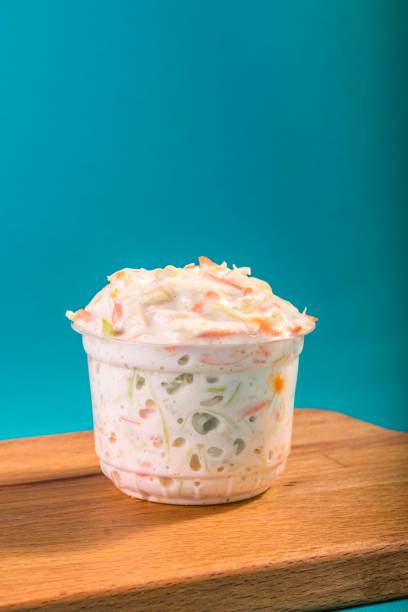 Fresh coleslaw salad Fresh coleslaw salad in a transparent plastic box coleslaw stock pictures, royalty-free photos & images