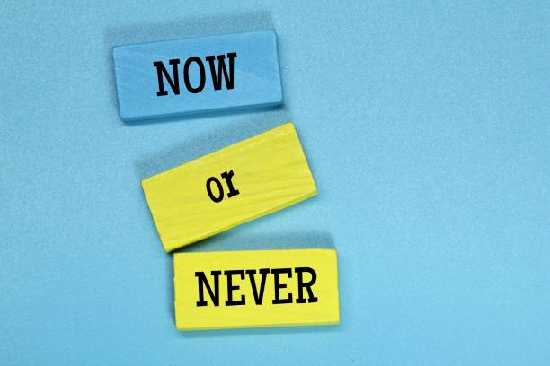 istock colored board with the word now or never 1444088223