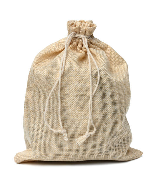istock Full canvas bag tied with rope and isolated on a white background 1444091777