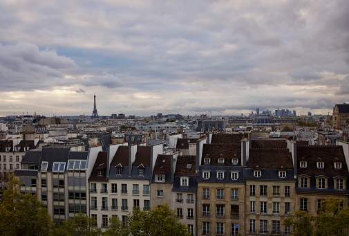 Paris skyline photographed with moody rainy sky.