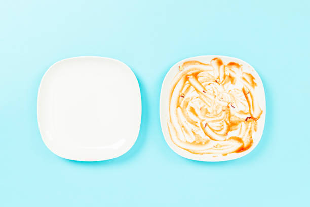 dirty and clean plates on blue floor
