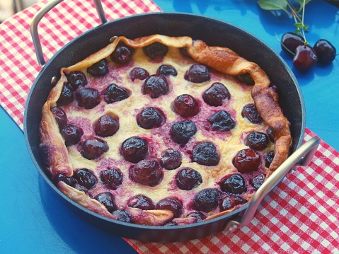 Homemade cherry clafoutis in a skillet pan
