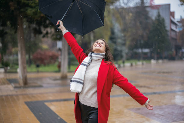 istock Young woman enjoying rainy weather 1444101435