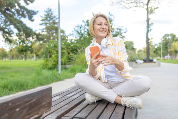 istock Woman sitting on a bench 1444113437