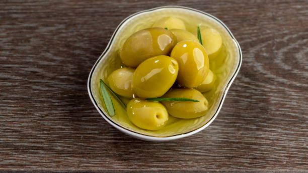 istock Green and black olives at breakfast on tabletop view. 1444113692