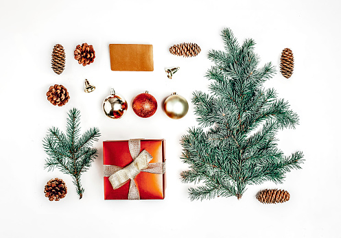 Christmas composition. Christmas gifts, pine branches, toys gift box, credit card on white background. Flat lay, top view.