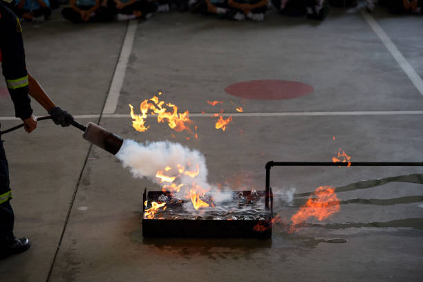 istock Cropped view of people in fire extinguishing approach training 1444116913