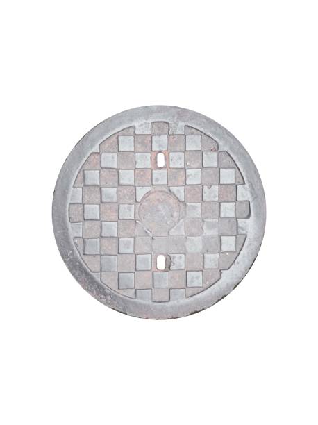 istock Old worn cast iron manhole cover isolated on white background, top view. 1444117230