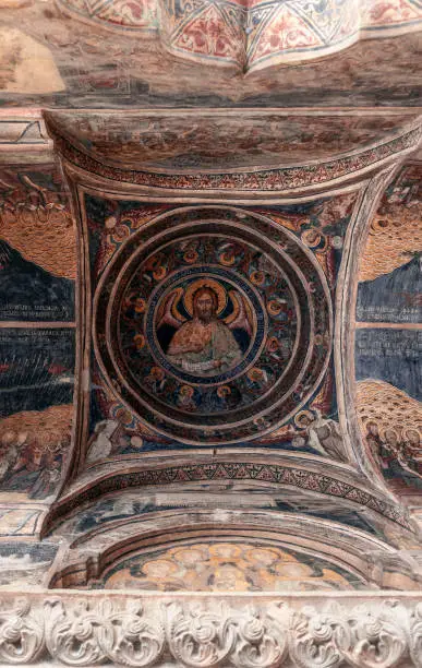 Photo of Religious frescoes painted on the ceiling of Stavropoleos Monastery Church (Manastirea Stavropoleos) dedicated to St. Archangels Michael and Gabriel. Bucharest, Romania