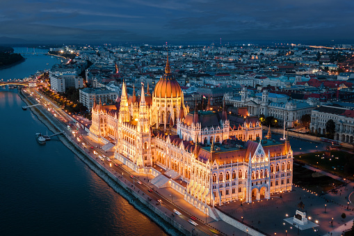 Aerial view of architectural landmark Hungarian Parliament building at dusk in Budapest, Hungary.