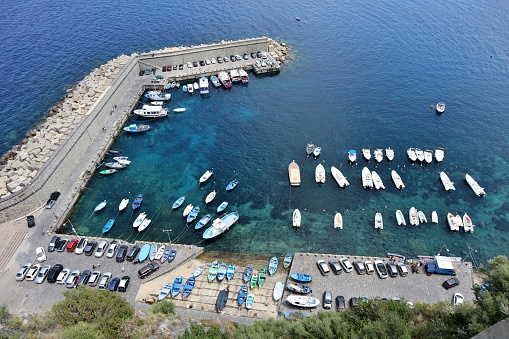 Scilla, Calabria, Italy – June 13, 2021: Tourist port from the terrace of Castello Ruffo