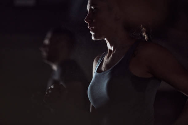 istock Athletic woman warming up in a gym. 1444122761