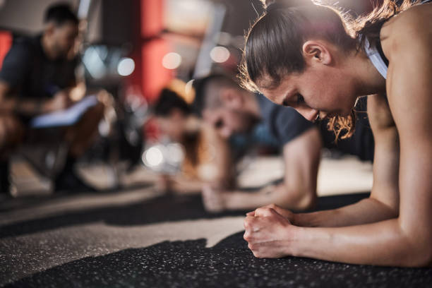 istock Exercising planks on sports training! 1444122945