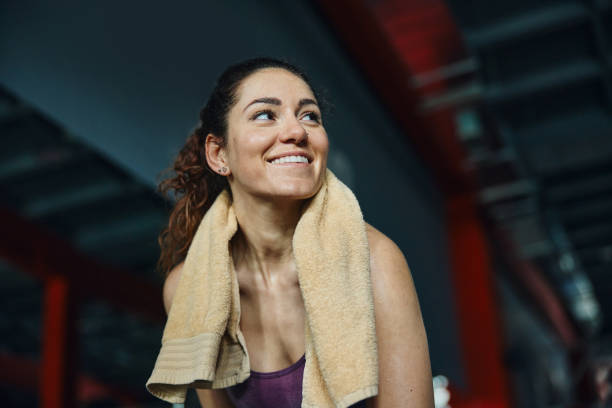 istock Happy athletic woman taking a break in a gym. 1444123104