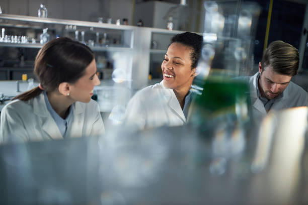 istock Happy female scientists talking in laboratory. 1444123384