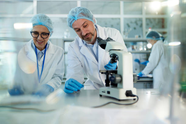 istock Two scientists working on a medical sample in laboratory. 1444123915