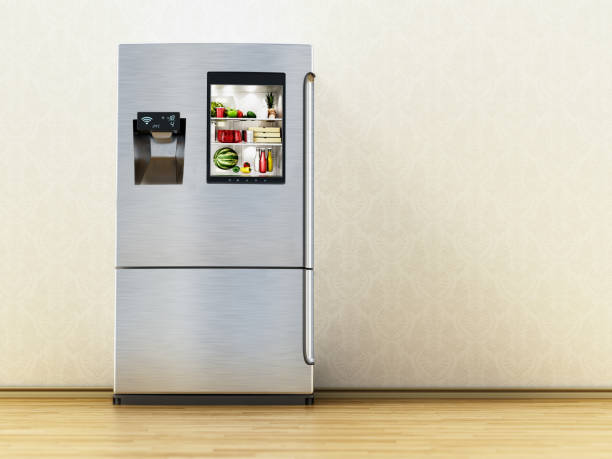 istock Smart refrigerator wtih display screen on the parquet floor. Copy space on the right side 1444125301