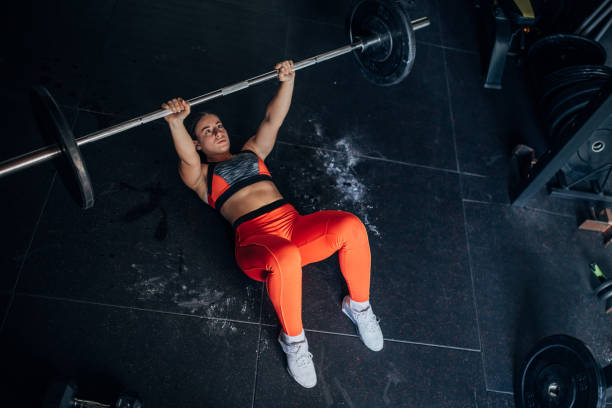 istock Fit woman training with weights 1444126655