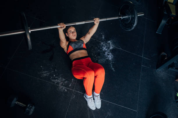 istock Fit woman training with weights 1444126753