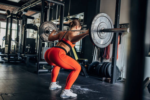 istock Fit woman training with weights 1444126891