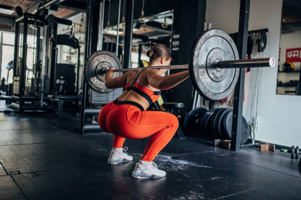 istock Fit woman training with weights 1444127039