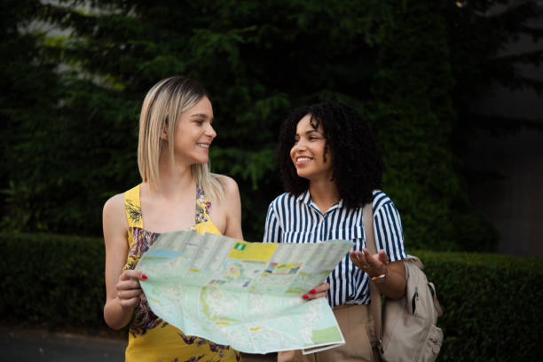 istock Two besties on a journey exploring the city map 1444128557