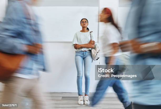 Student Anxiety And Woman In Busy College Campus With Depression Sad And Mental Health Problems Burnout Stress And Tired Girl Thinking About Exam Assignment Or Project Deadline At University Stock Photo - Download Image Now