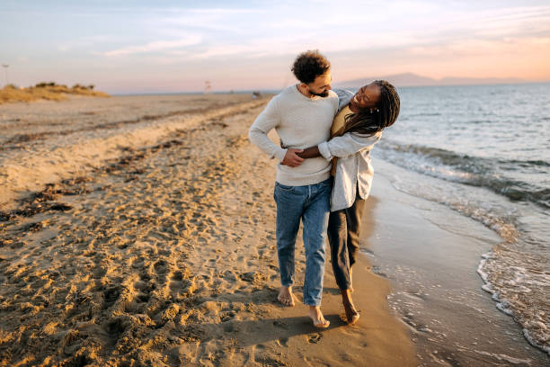 Wherever you go, i'll follow you Couple walking by the sea black romantic stock pictures, royalty-free photos & images