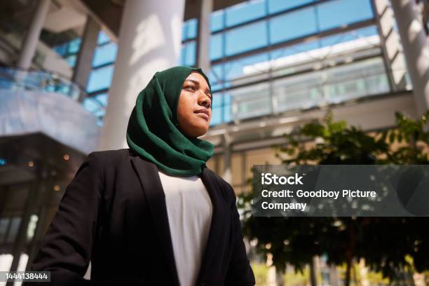 Confident Young Muslim Businesswoman Standing In An Office Building Lobby Stock Photo - Download Image Now
