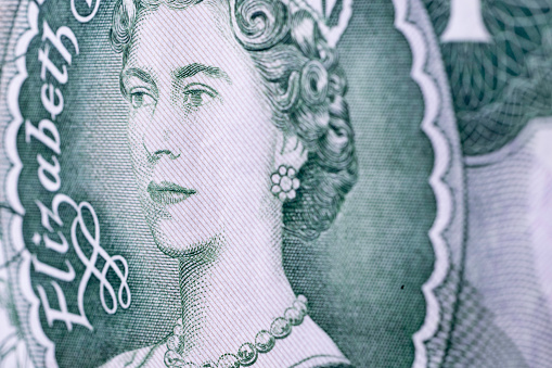 Haverfordwest, Wales - November 23, 2022: Studio shot of a detail of an obsolete UK one pound note. These were first used in 1797 and lasted beyond UK's decimalisation in 1971 before being phased out in 1988 when they were replaced with a coin.